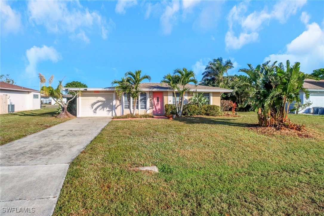 a view of a house with a yard