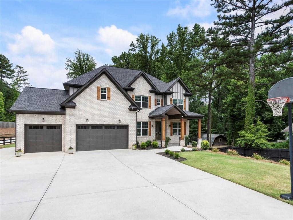 a front view of a house with a yard and garage