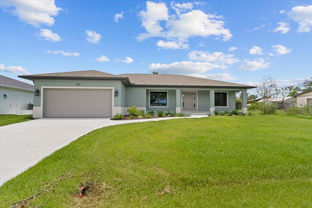 a view of house with yard outdoor seating and entertaining space