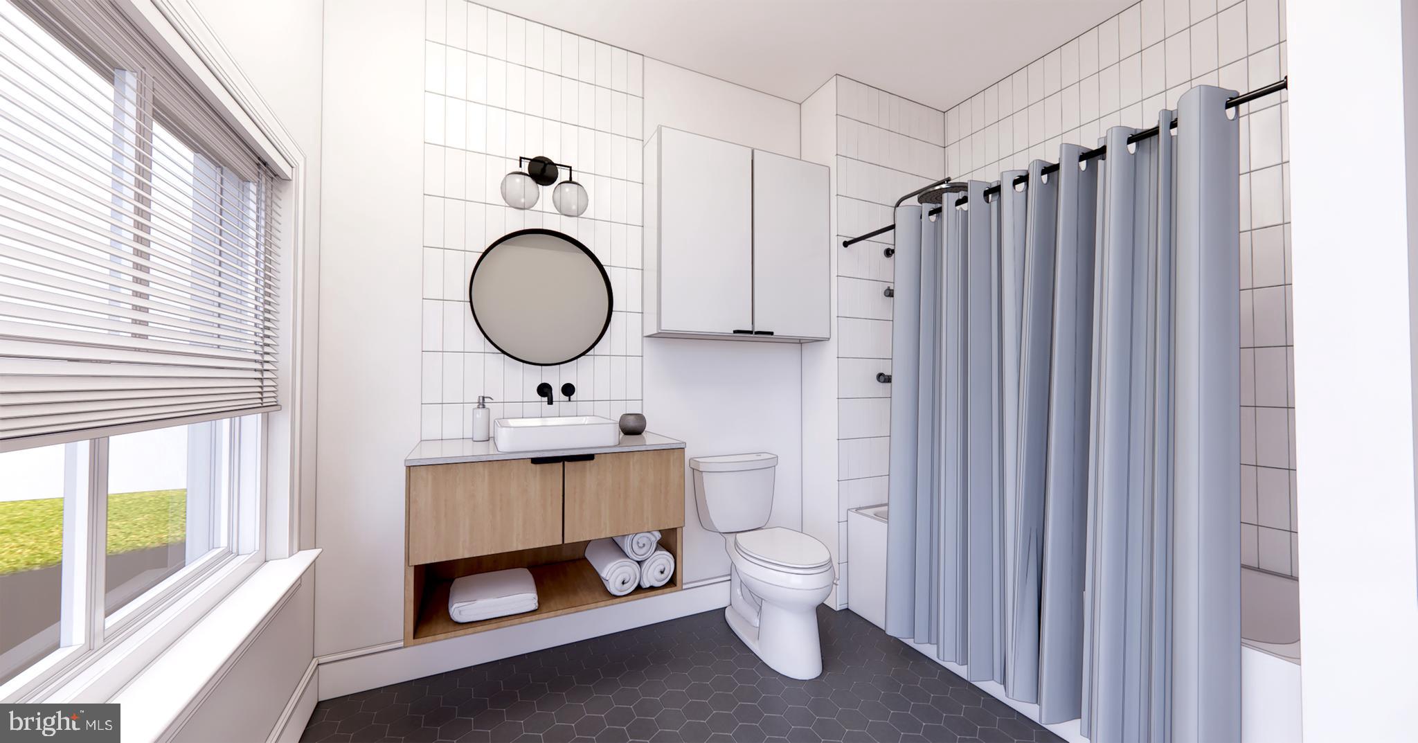 a bathroom with a sink a toilet and a window