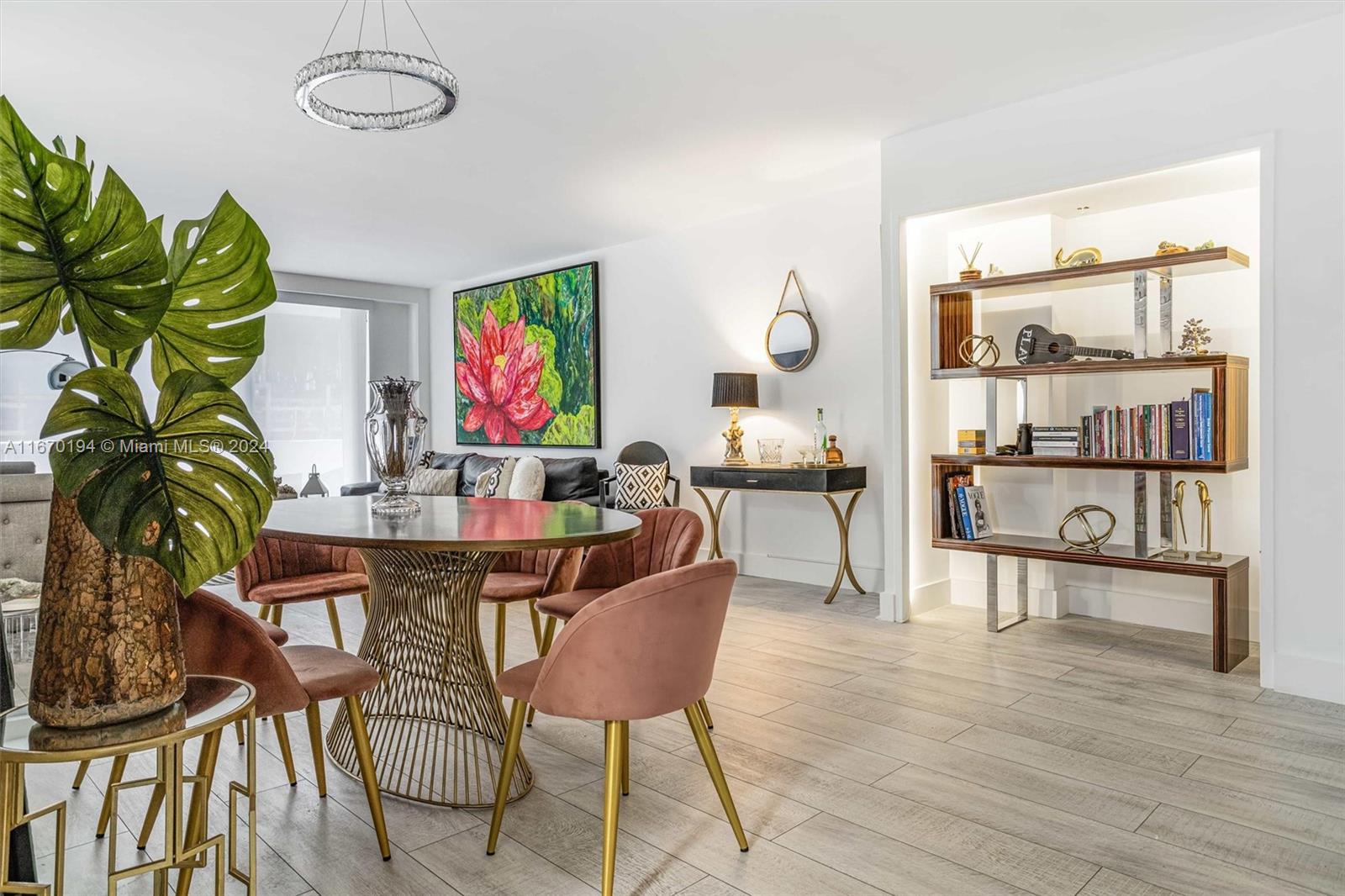 a living room with furniture cabinets and wooden floor