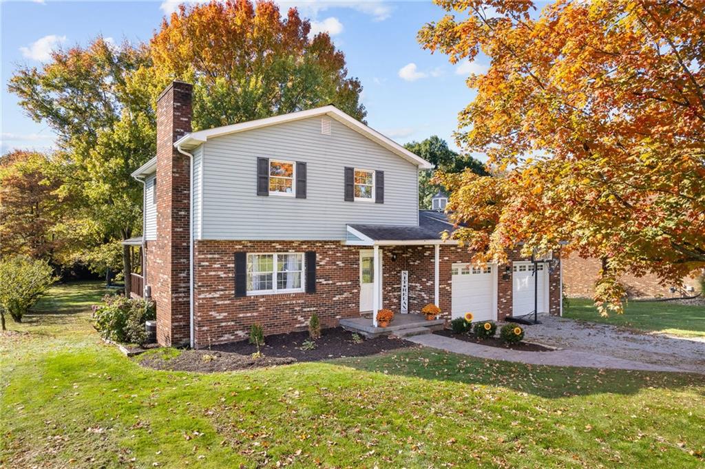 a view of a house with a yard