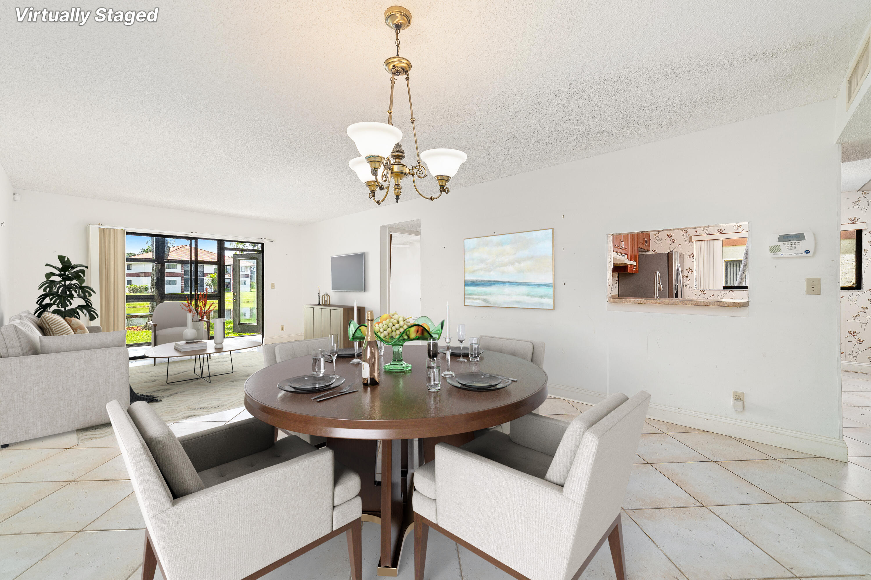 a view of a dining room with furniture and chandelier