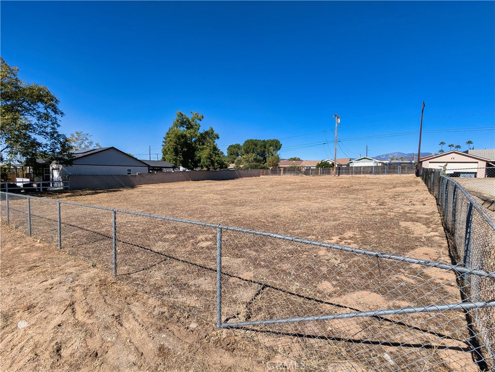 a view of a backyard of the house