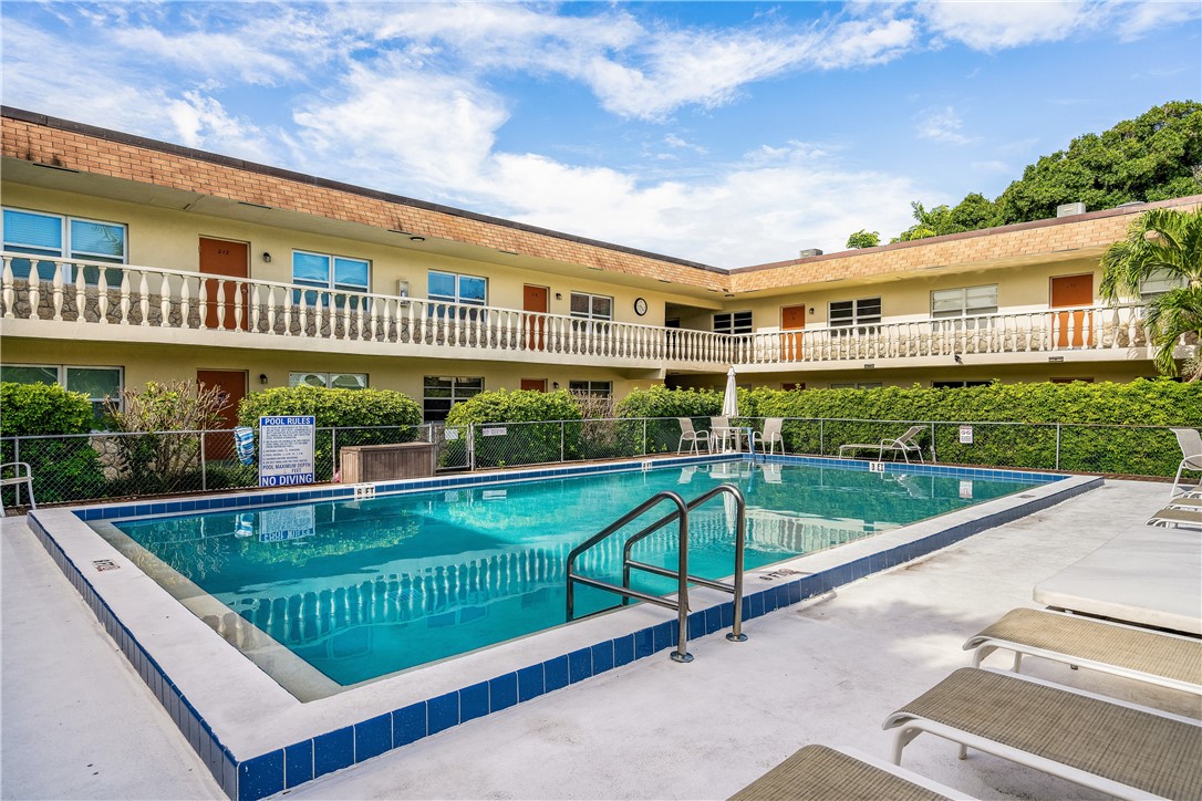 a view of swimming pool with a patio