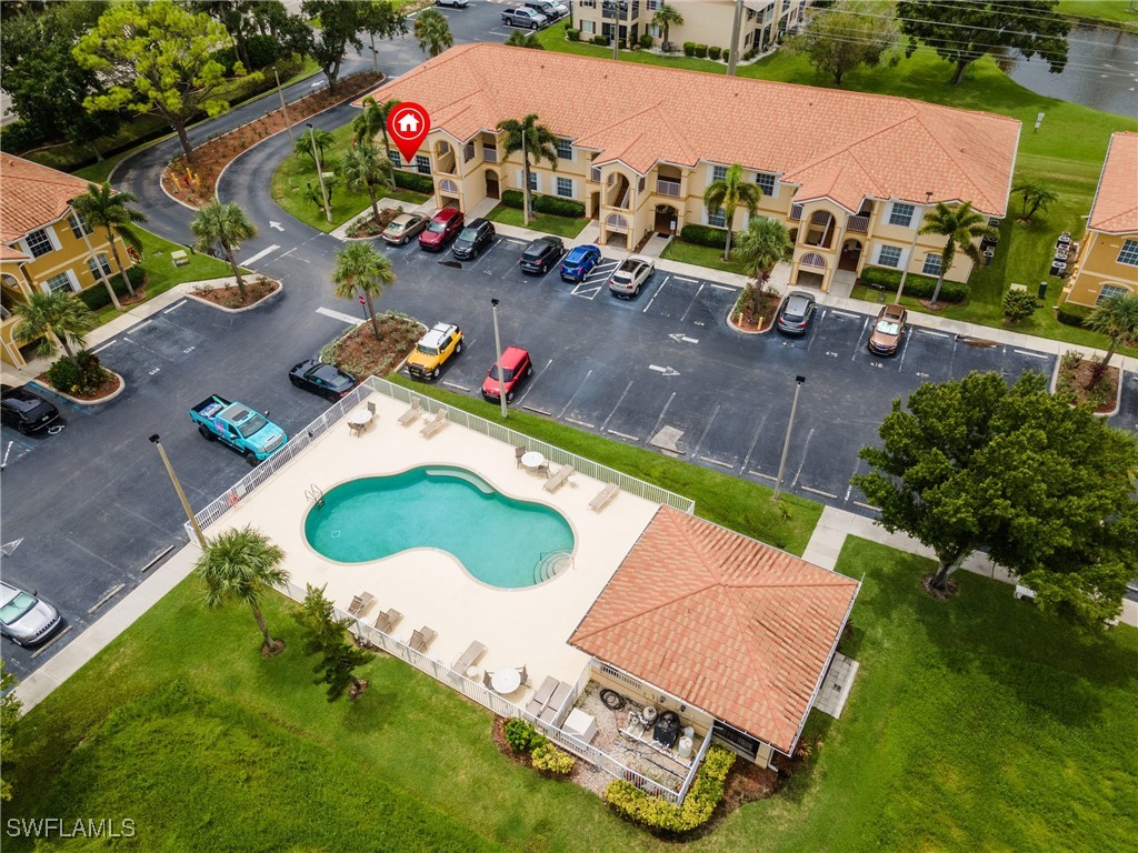 an aerial view of a house with a yard