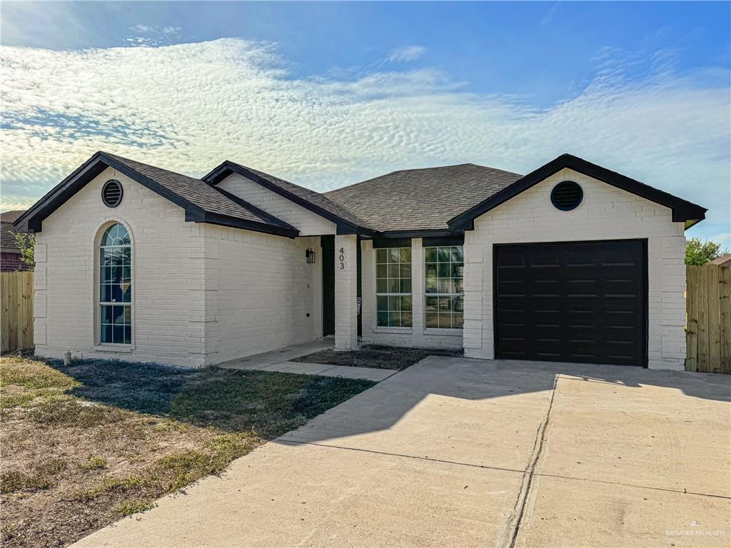 Ranch-style home with a garage