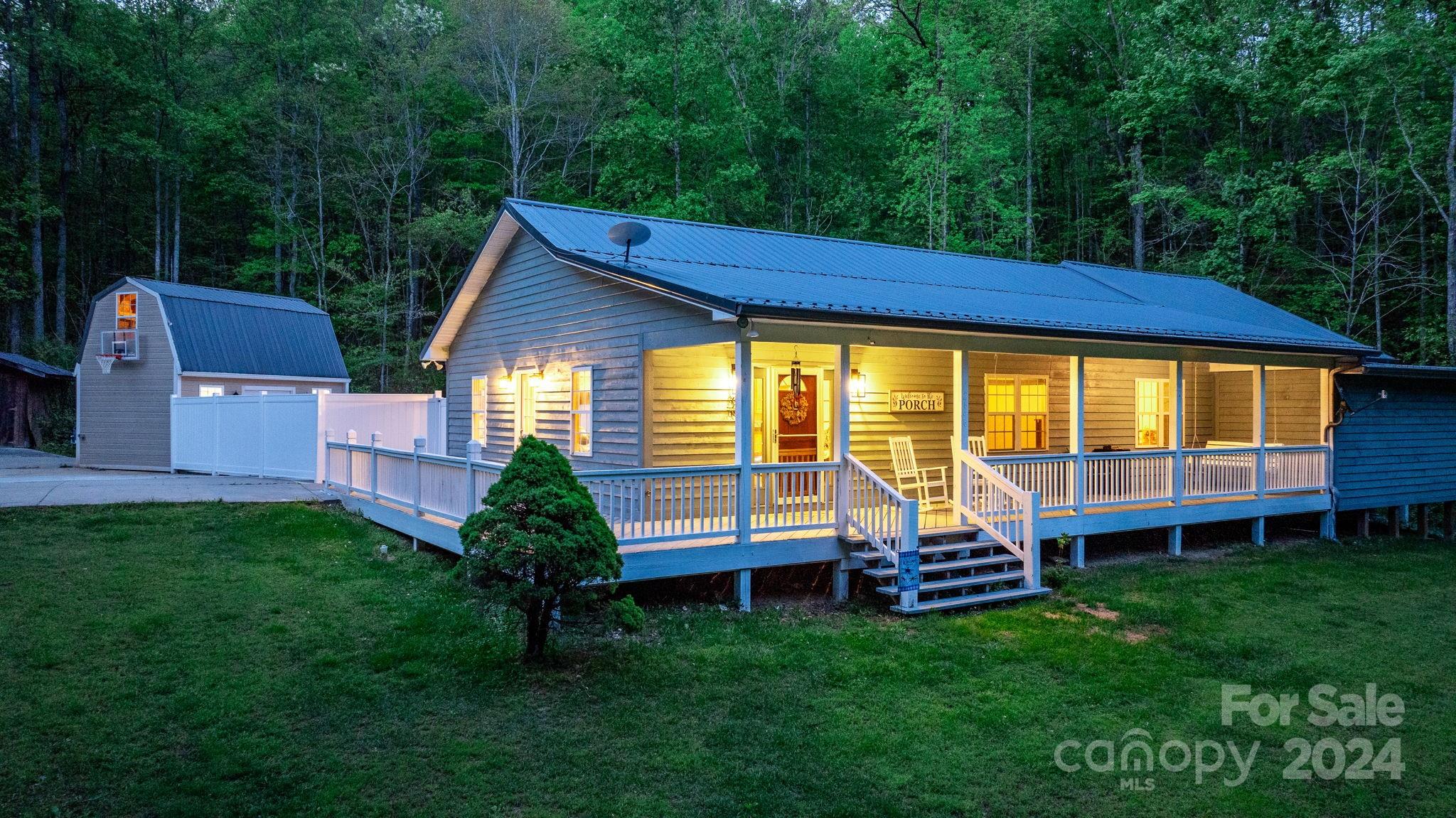 a backyard of a house with wooden floor and fence