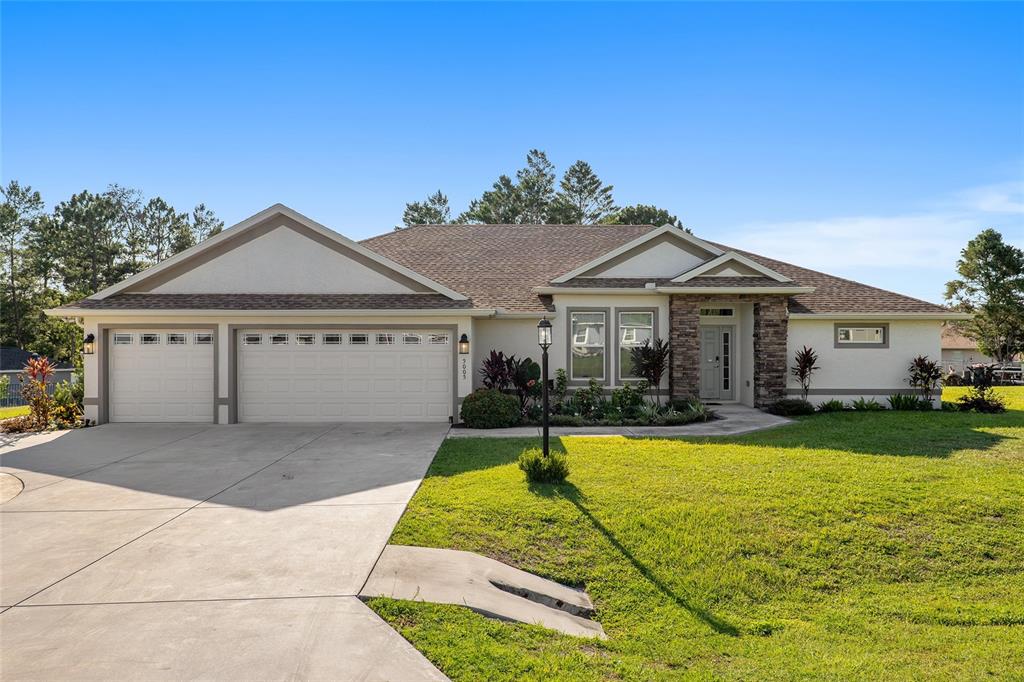 a front view of a house with swimming pool