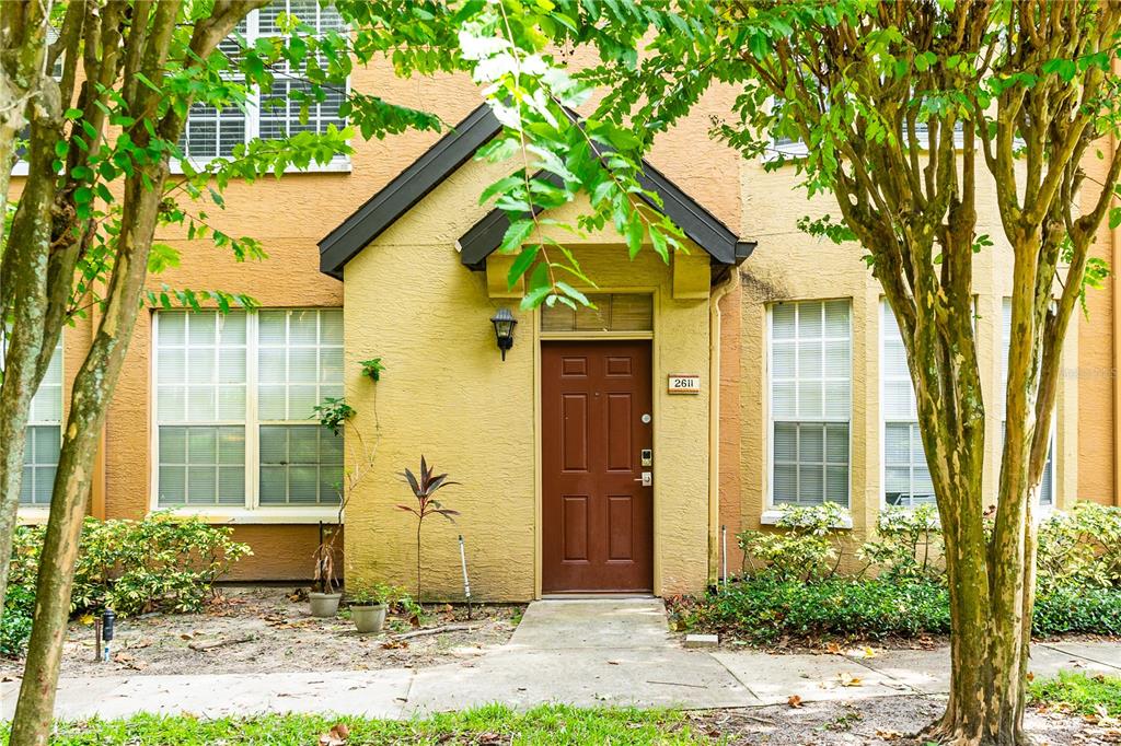 a front view of a house with garden