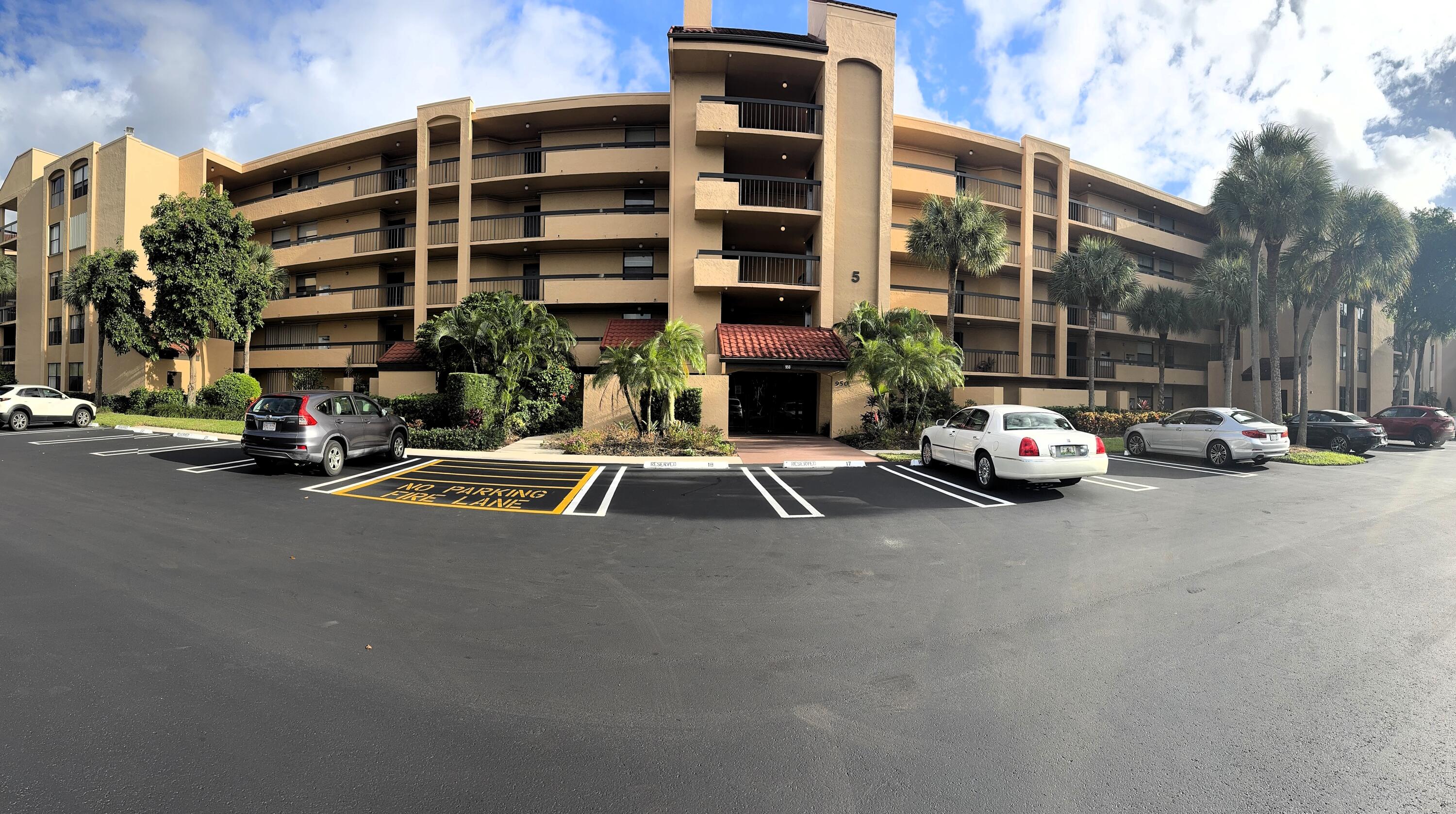 a view of a street with a cars parked in front of it