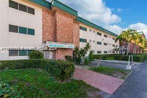 a view of a building with a yard