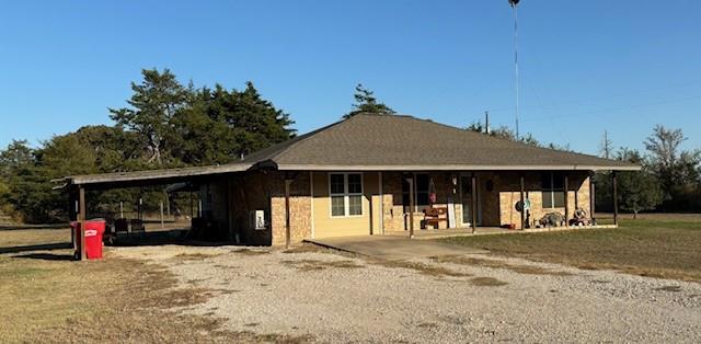 a front view of a house with basket ball court