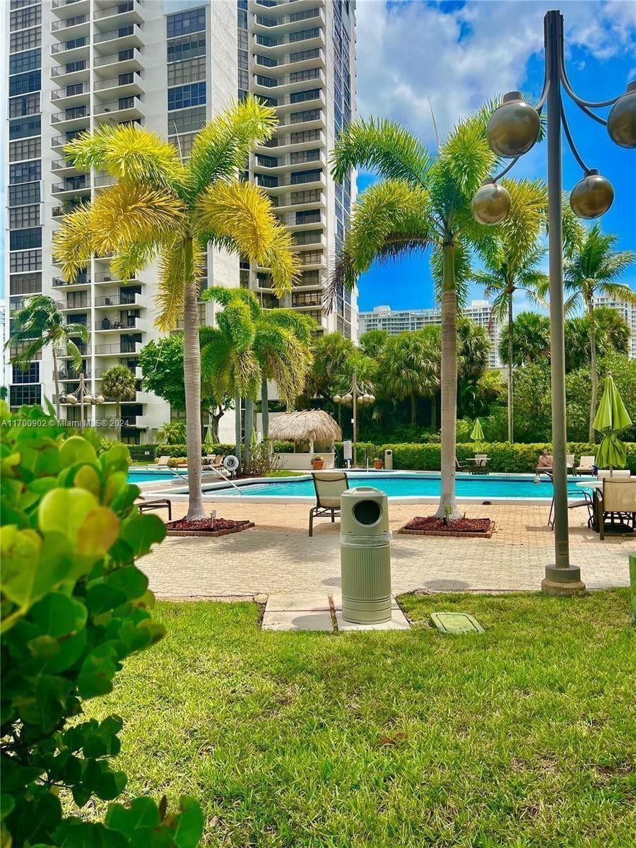 a view of a swimming pool with a sitting area