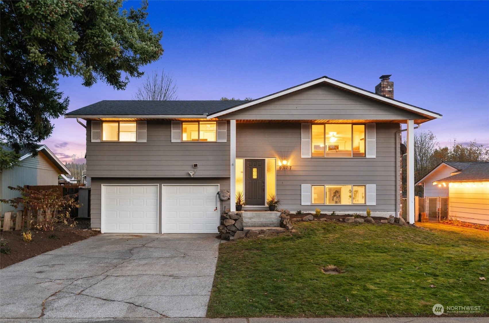 a front view of a house with a yard