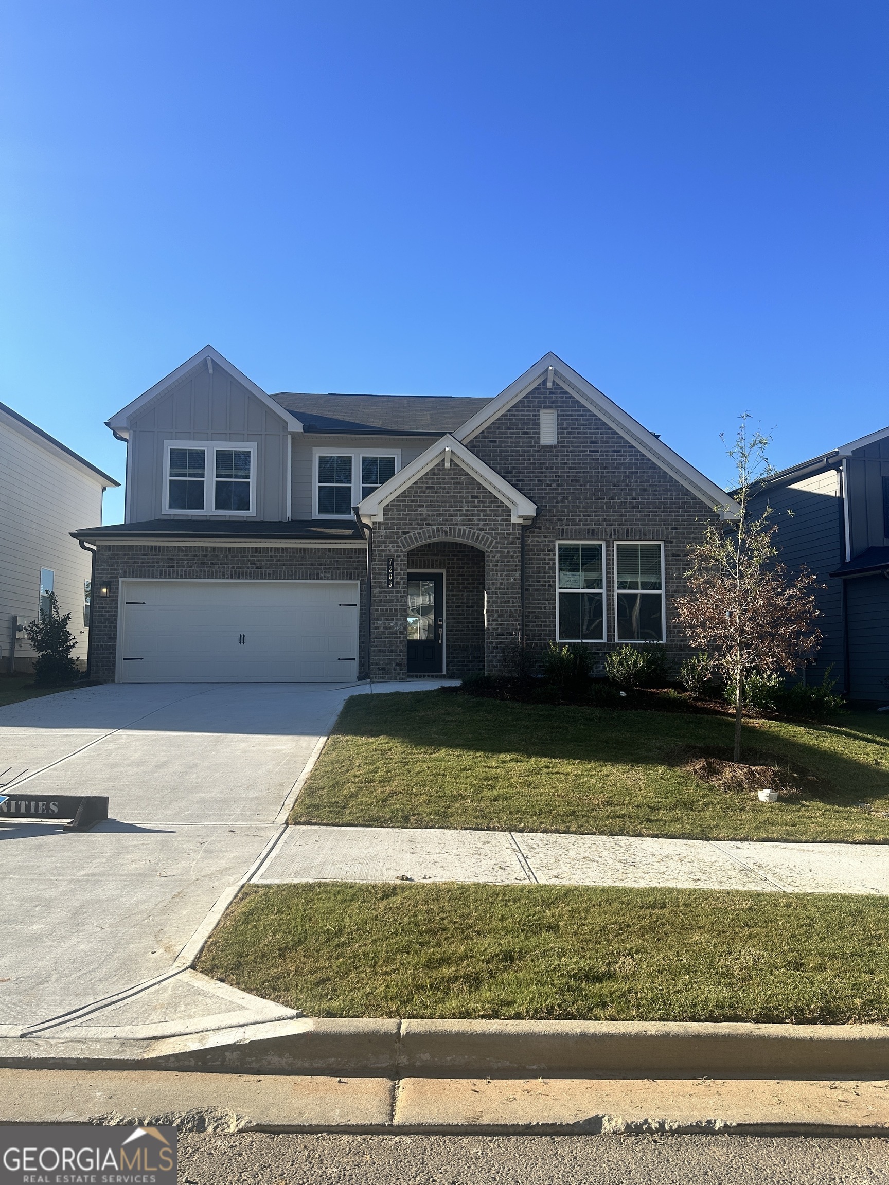 a front view of a house with a yard