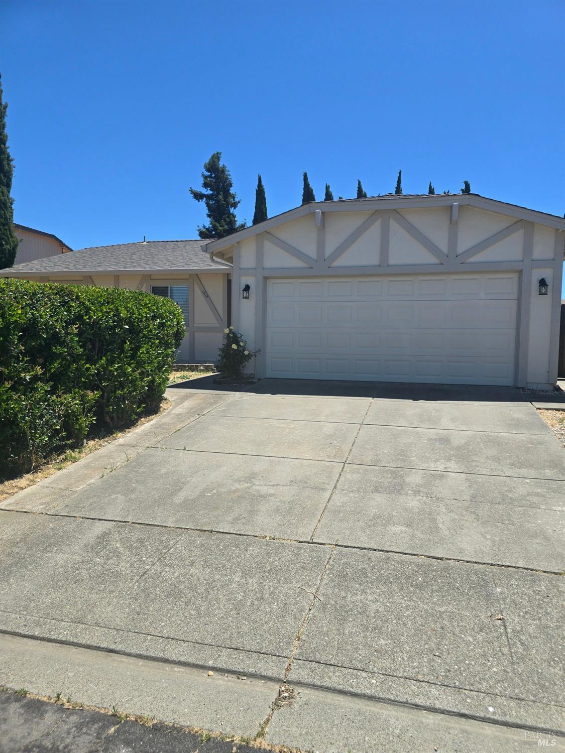 a view of a front of house with a street