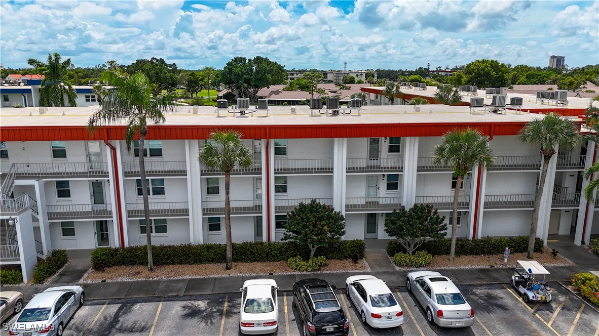 a view of a car park in front of a building