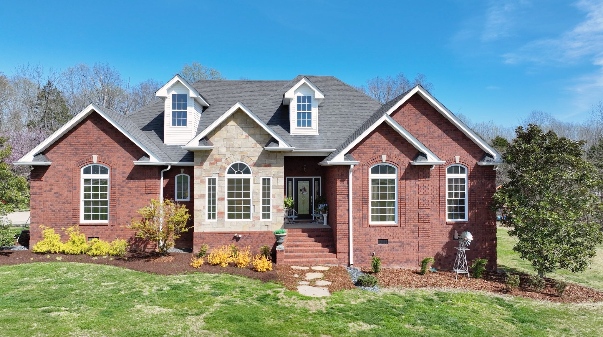 a front view of a house with a yard