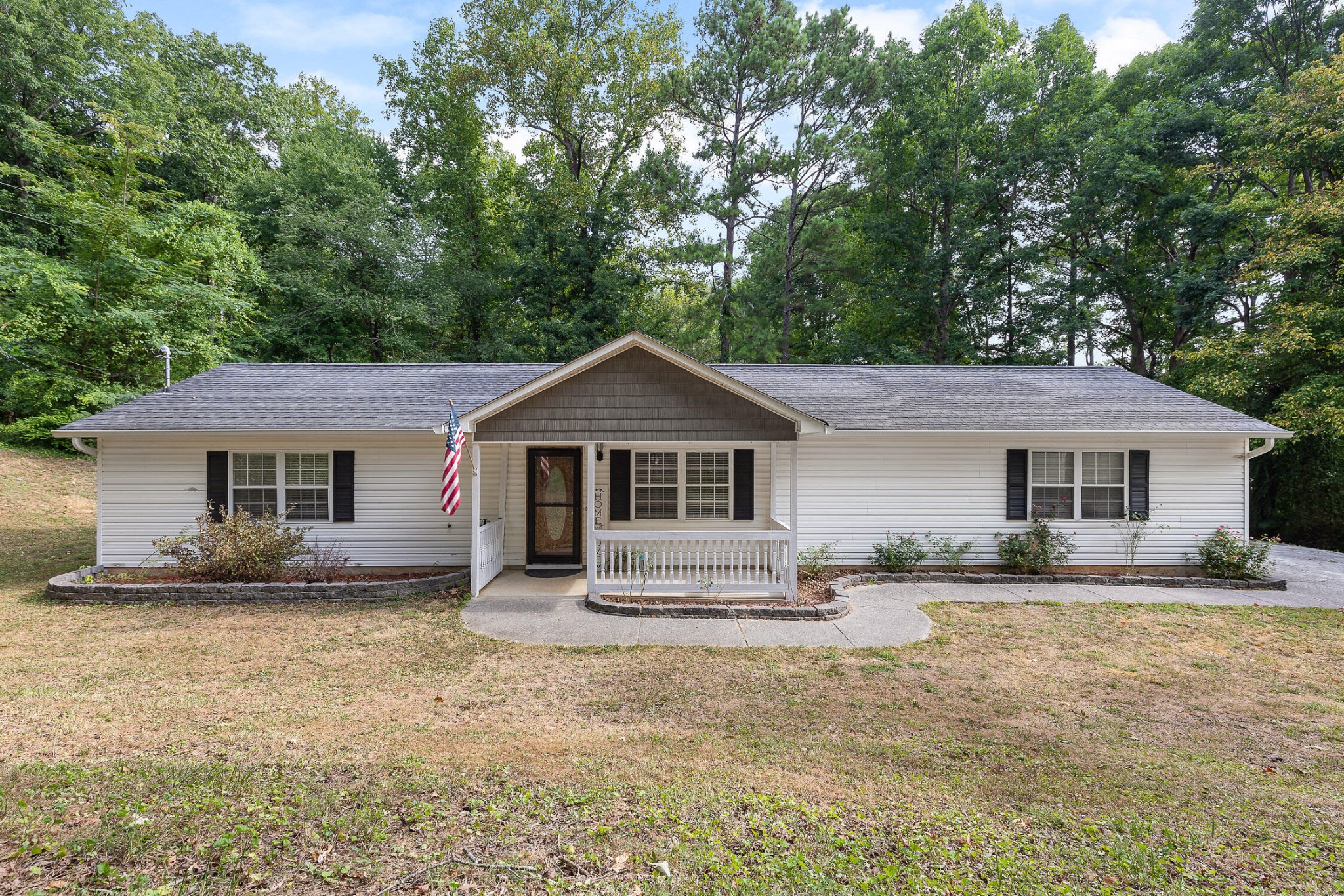 a front view of a house with a yard