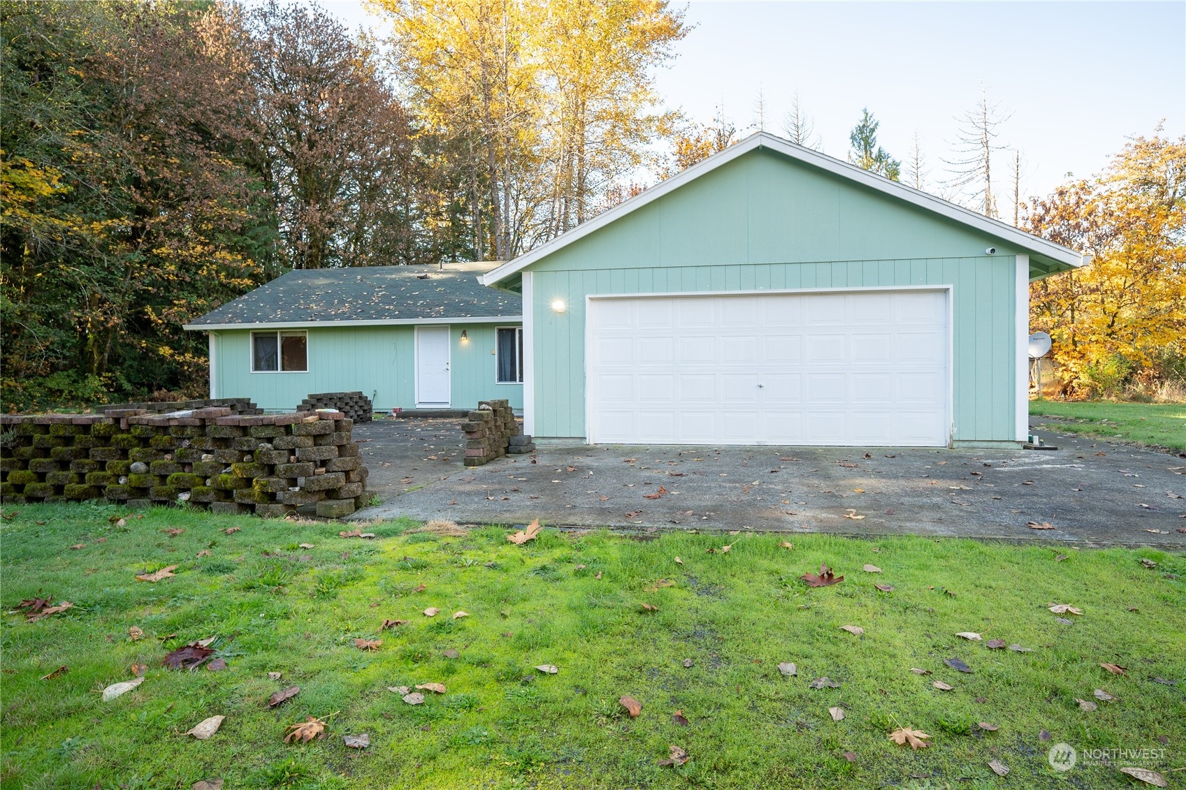 a front view of house with yard and green space