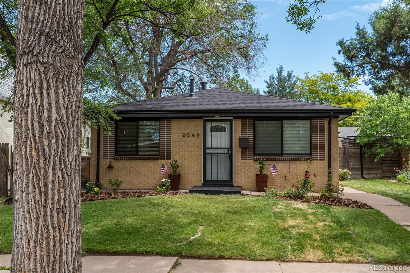 front view of a house with a yard