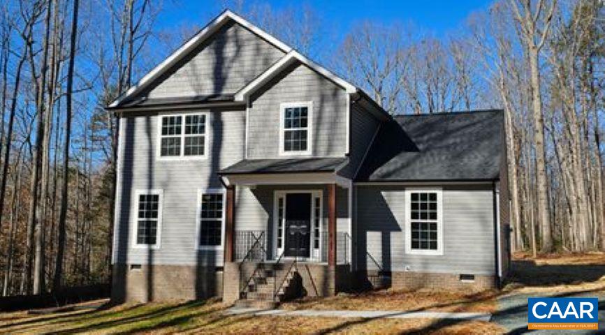 a front view of a house with glass windows