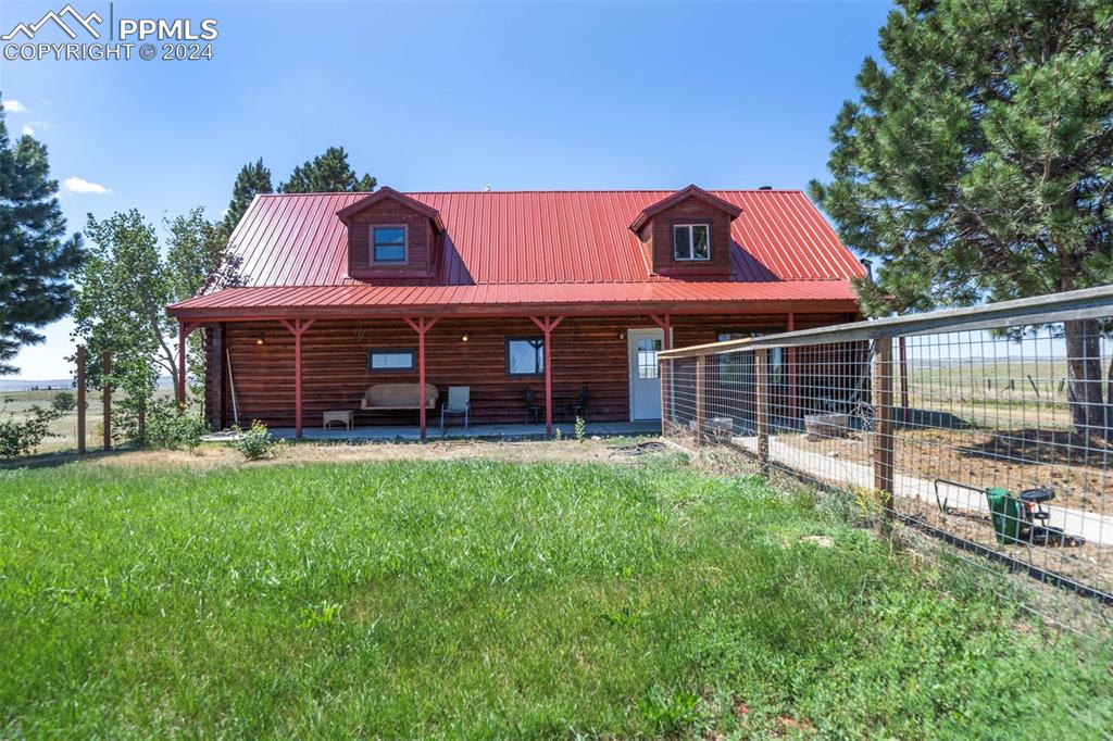 Log home with a front lawn