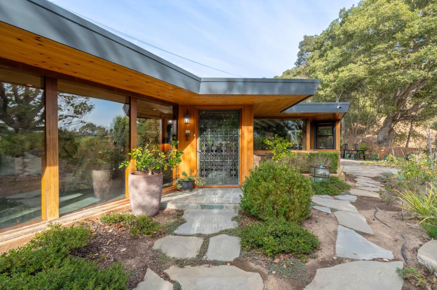 a front view of a house with garden