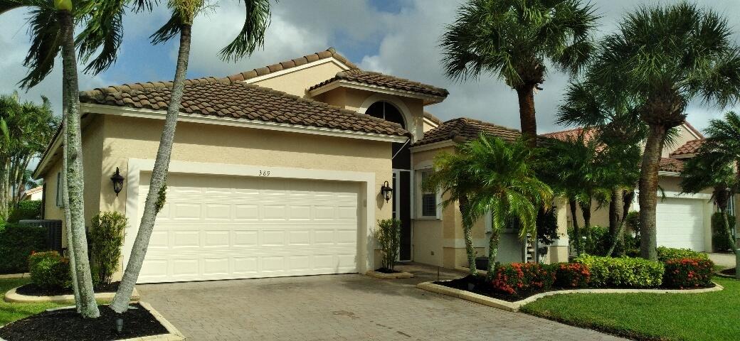 a front view of a house with a garage