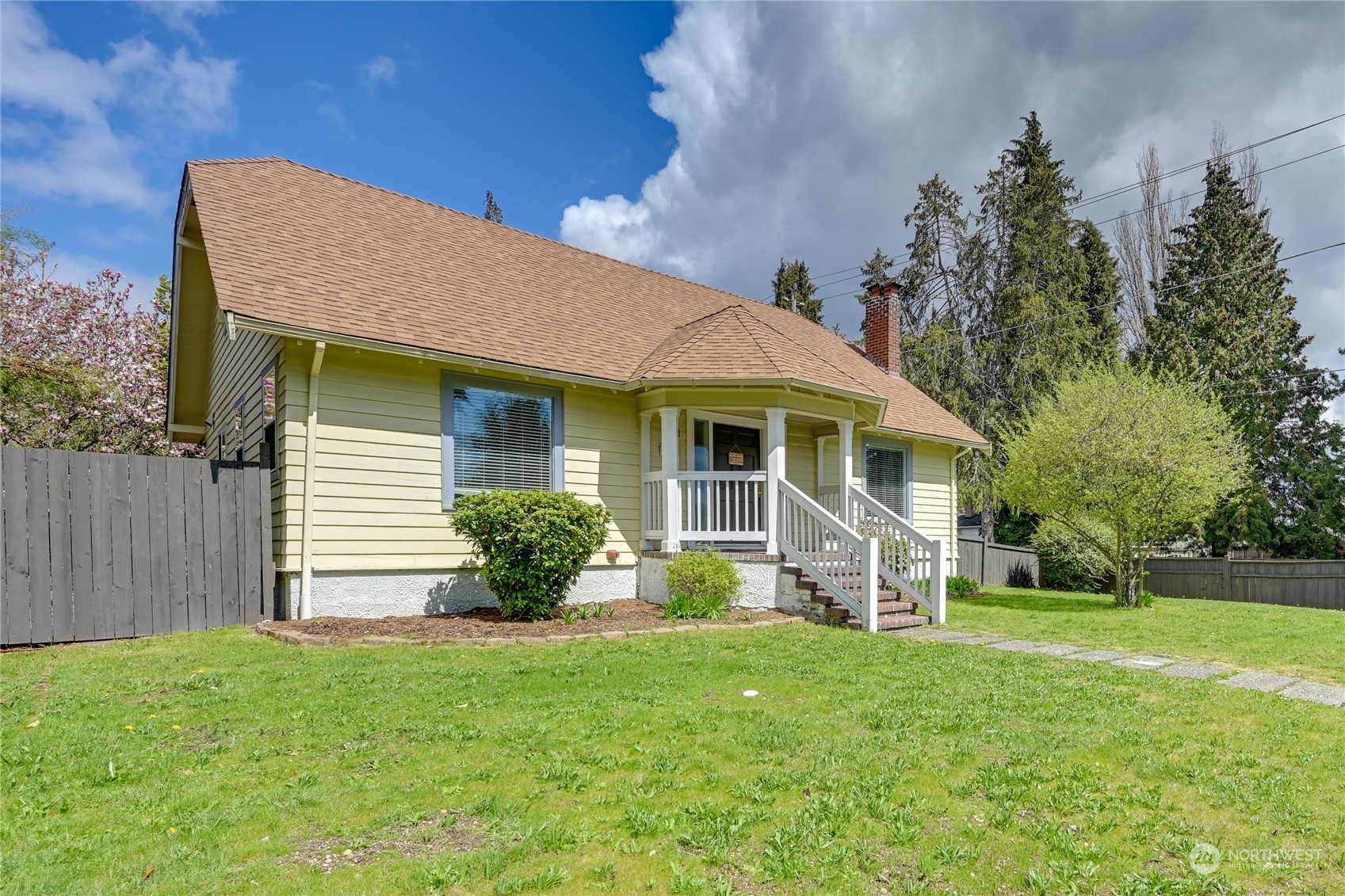 a front view of a house with garden