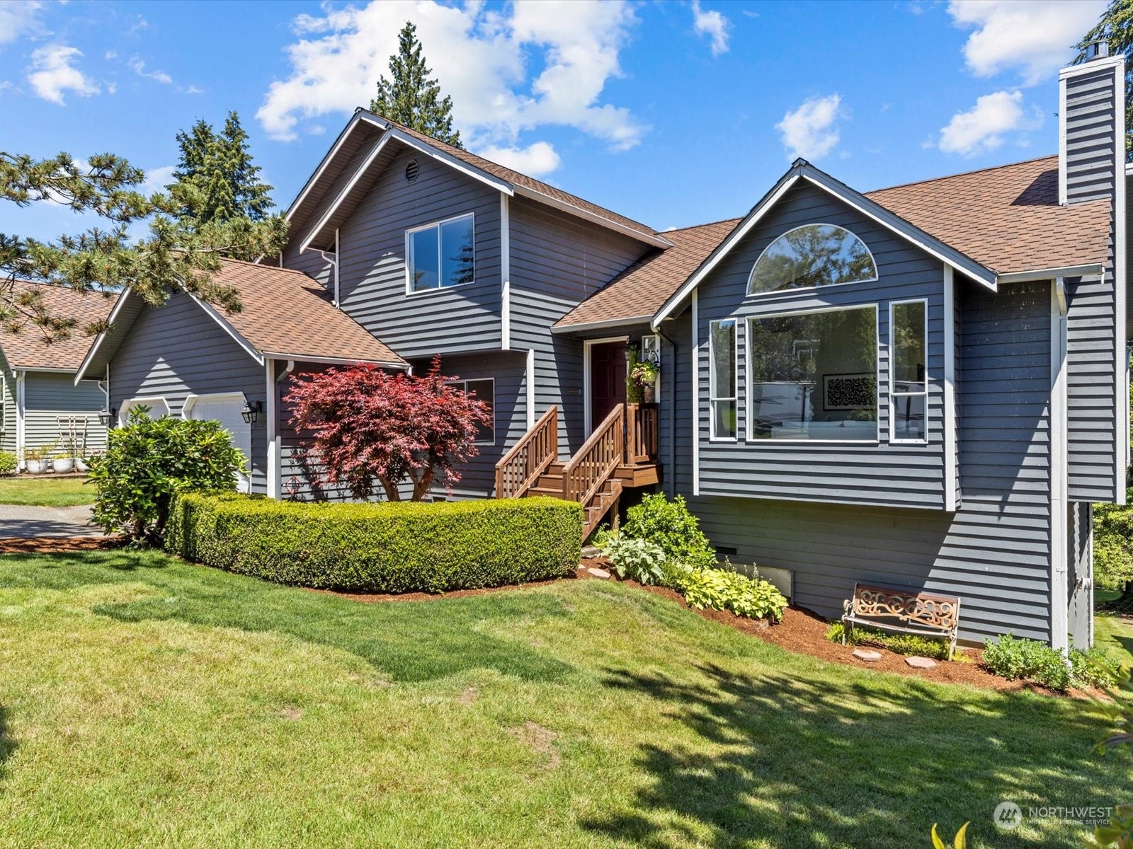 a front view of a house with garden