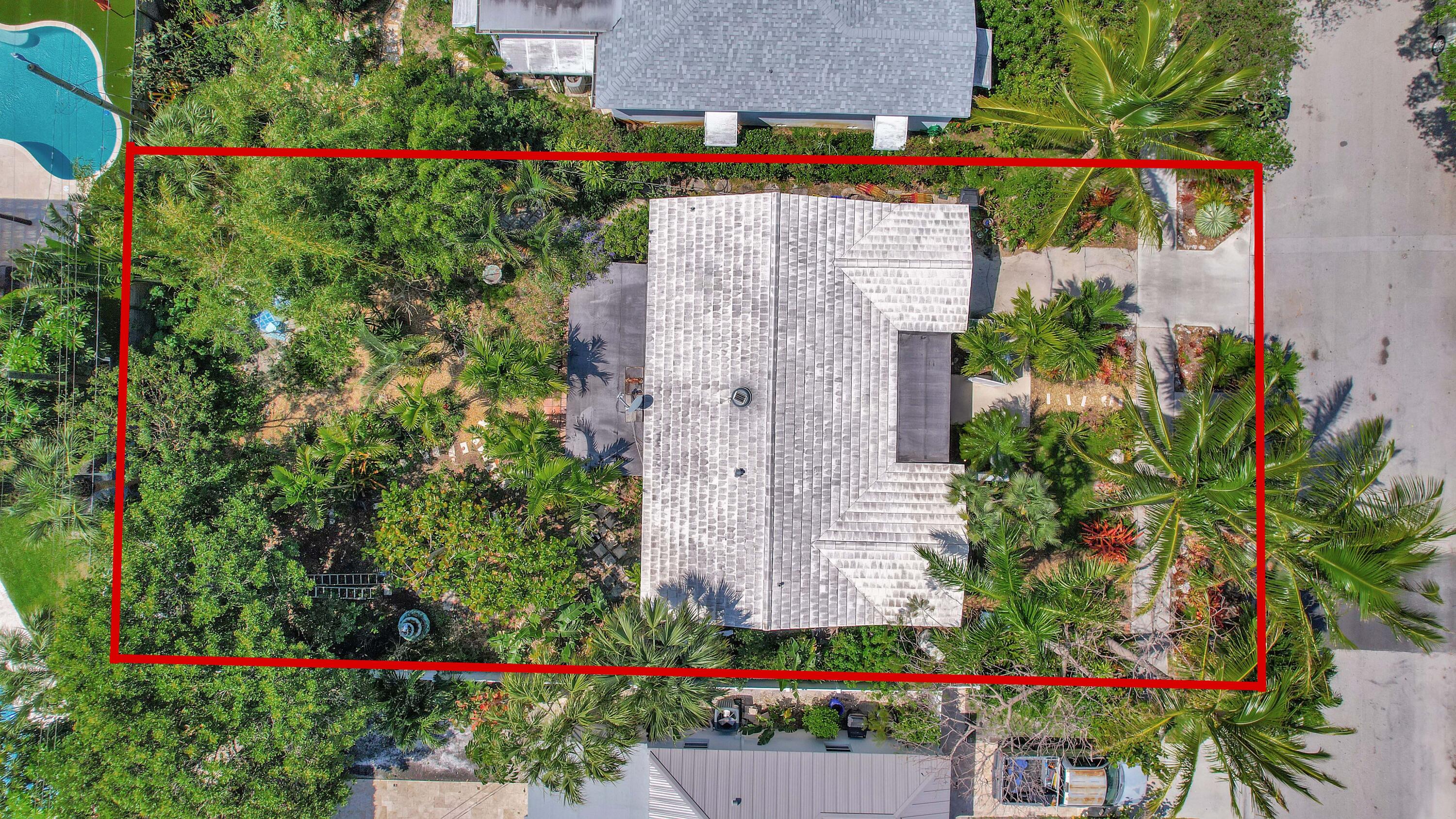 an aerial view of a house and a yard and a sitting area