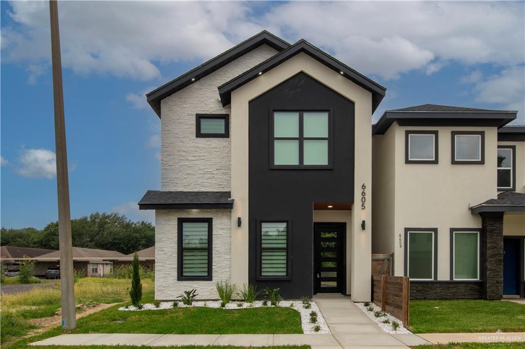 View of front of home featuring a front lawn