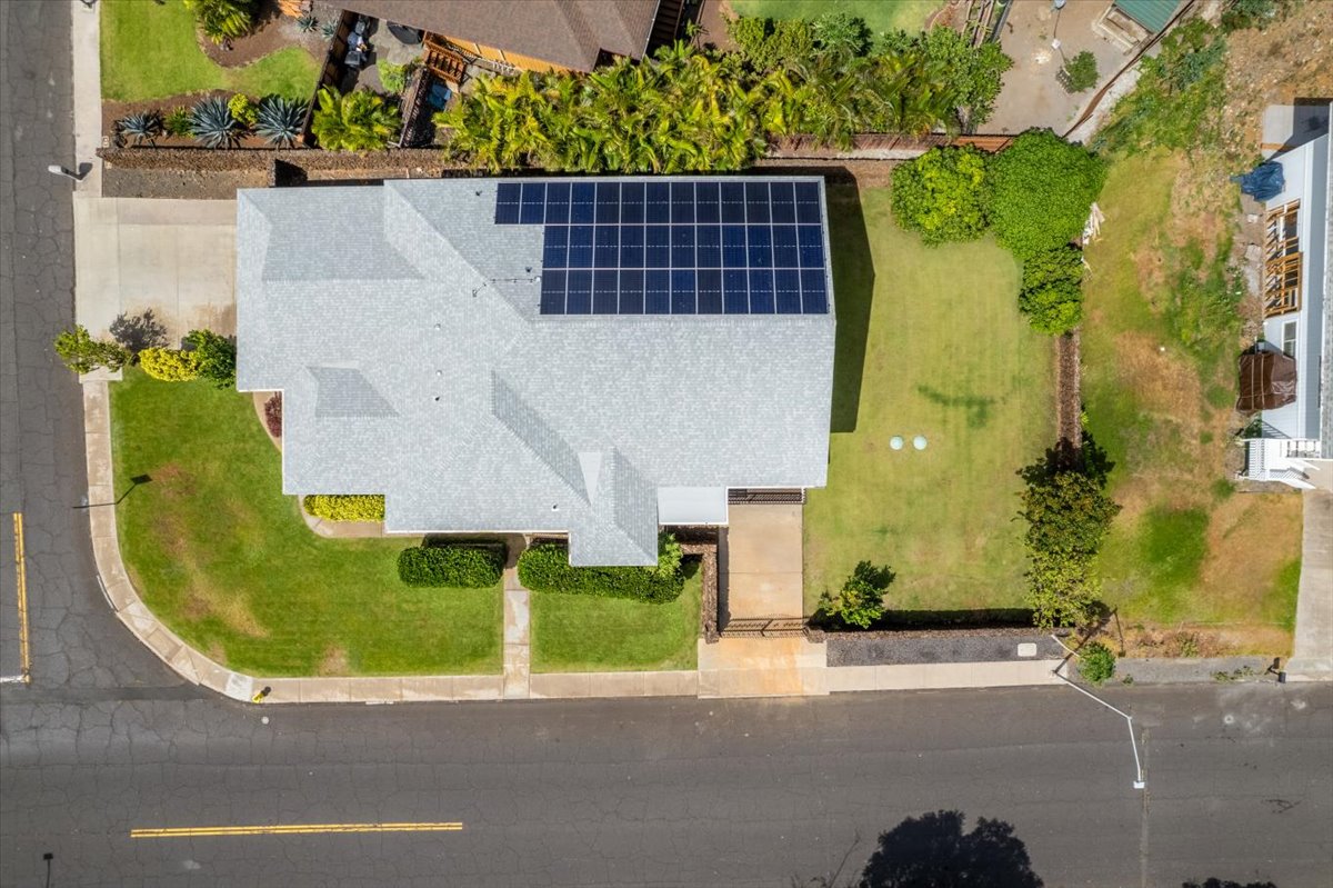 an aerial view of a house with a swimming pool