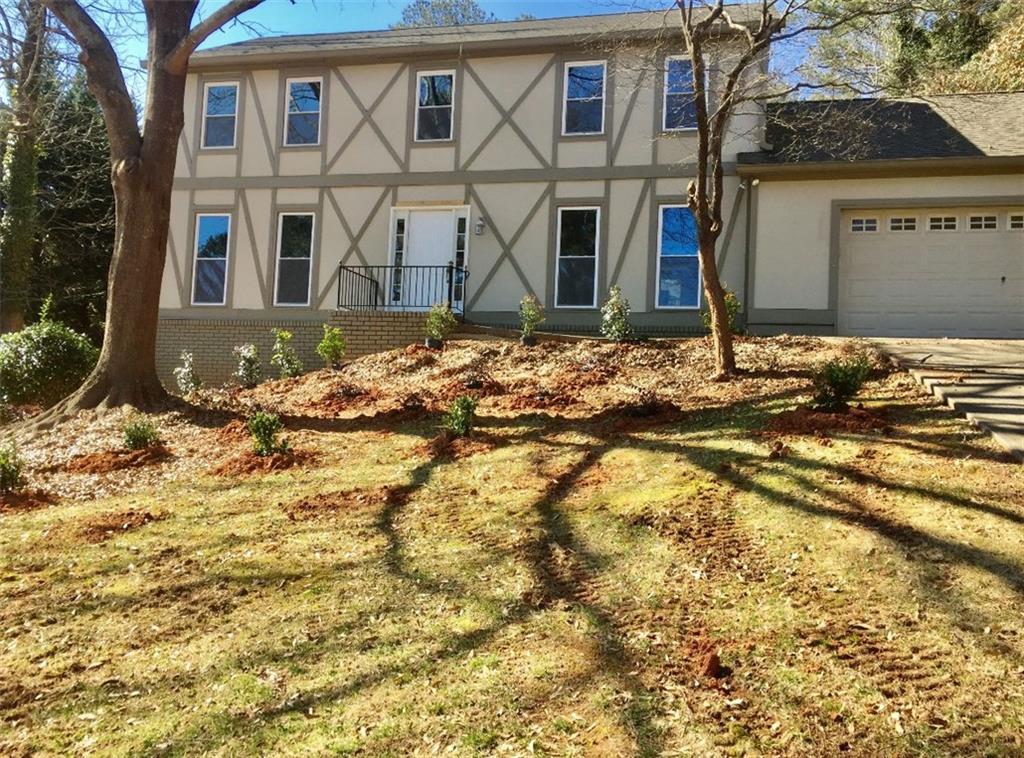 a view of a house with snow on the side of it