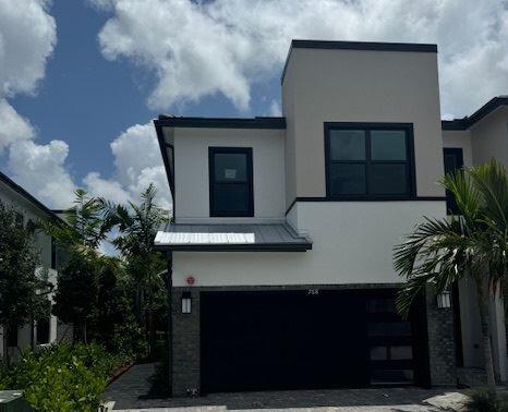 a front view of a house with yard