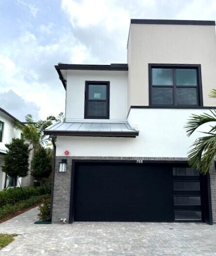 a front view of a house with parking