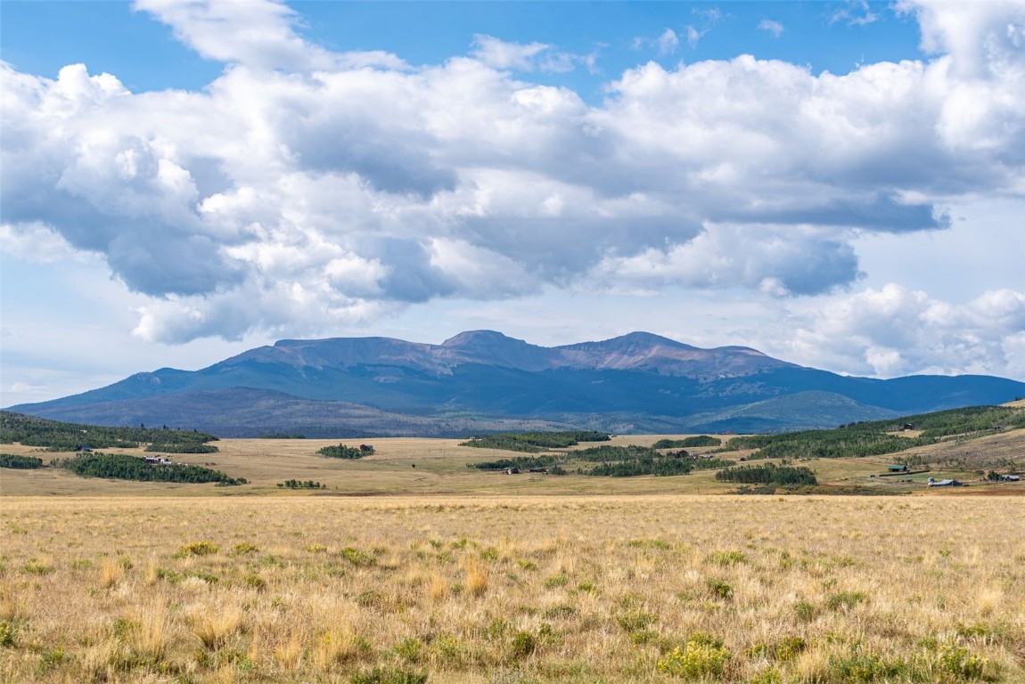 a view of a large body of water and mountain