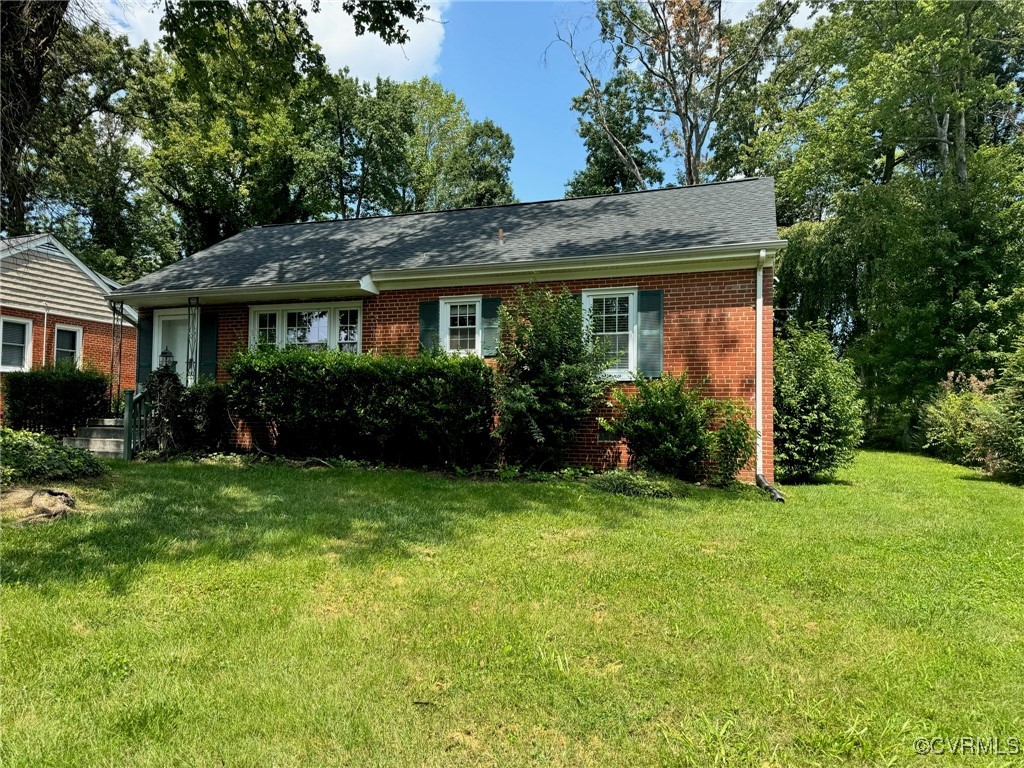 a view of a house with garden and yard