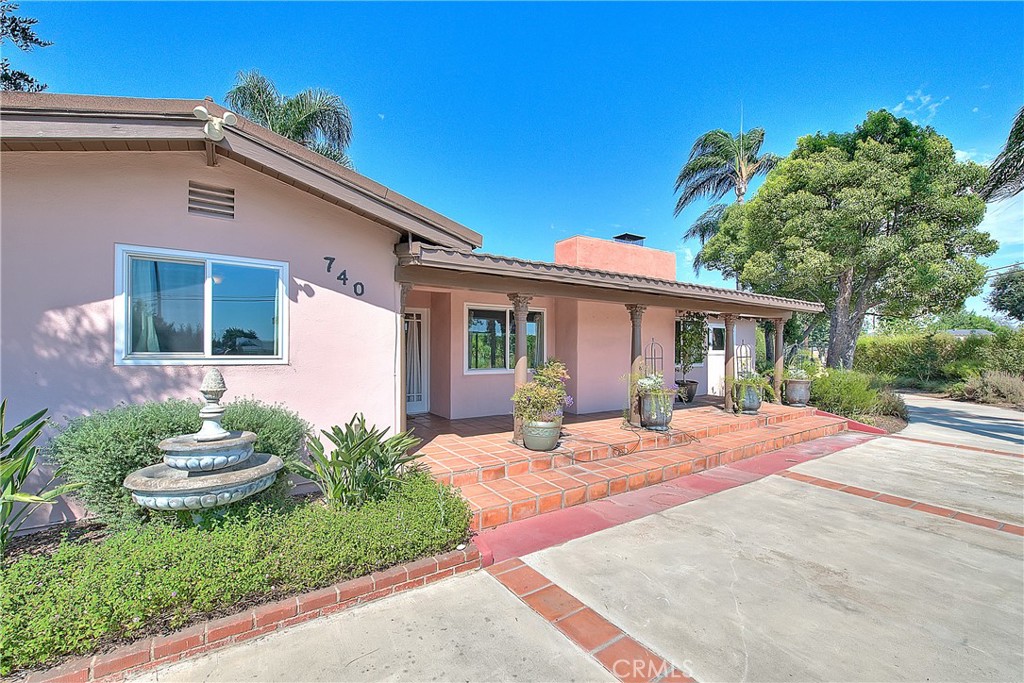 a front view of a house with a patio