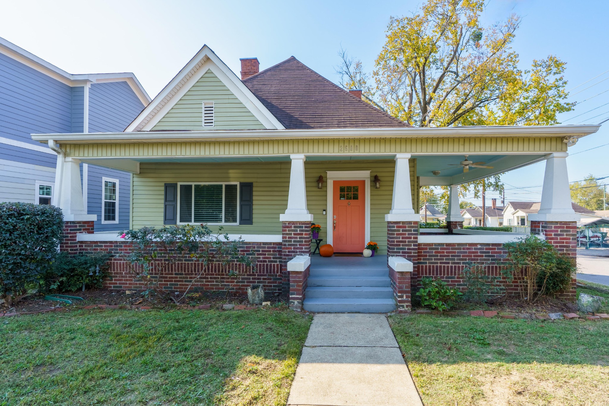 a front view of a house with garden