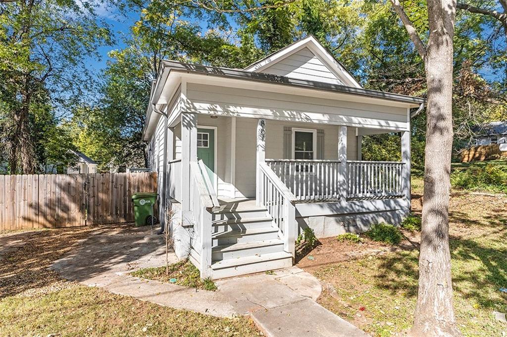 a front view of a house with a porch