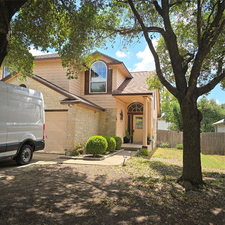 a view of a car park in front of a house