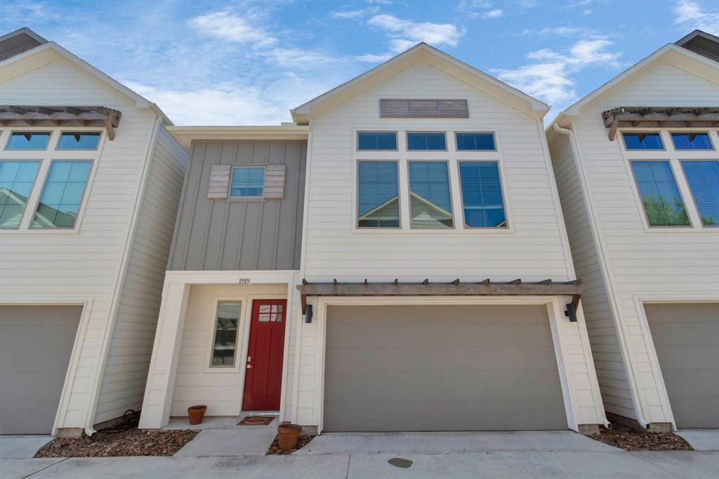 a front view of a house with a garage