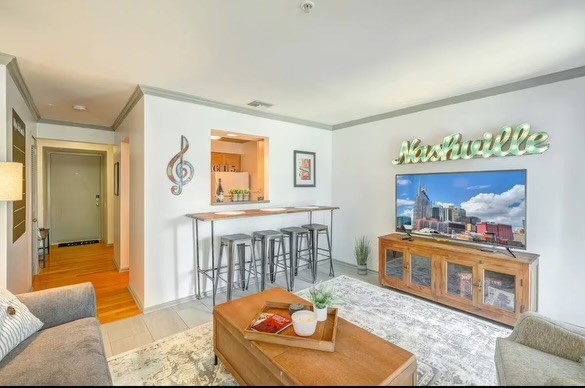 a living room with furniture and a table