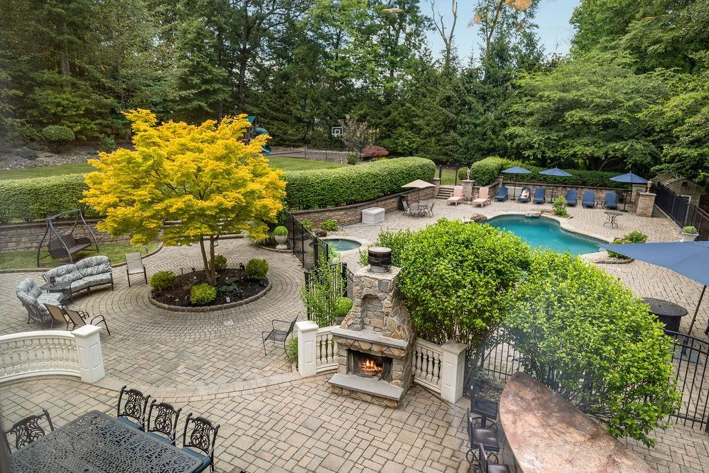 a view of a backyard with plants and patio