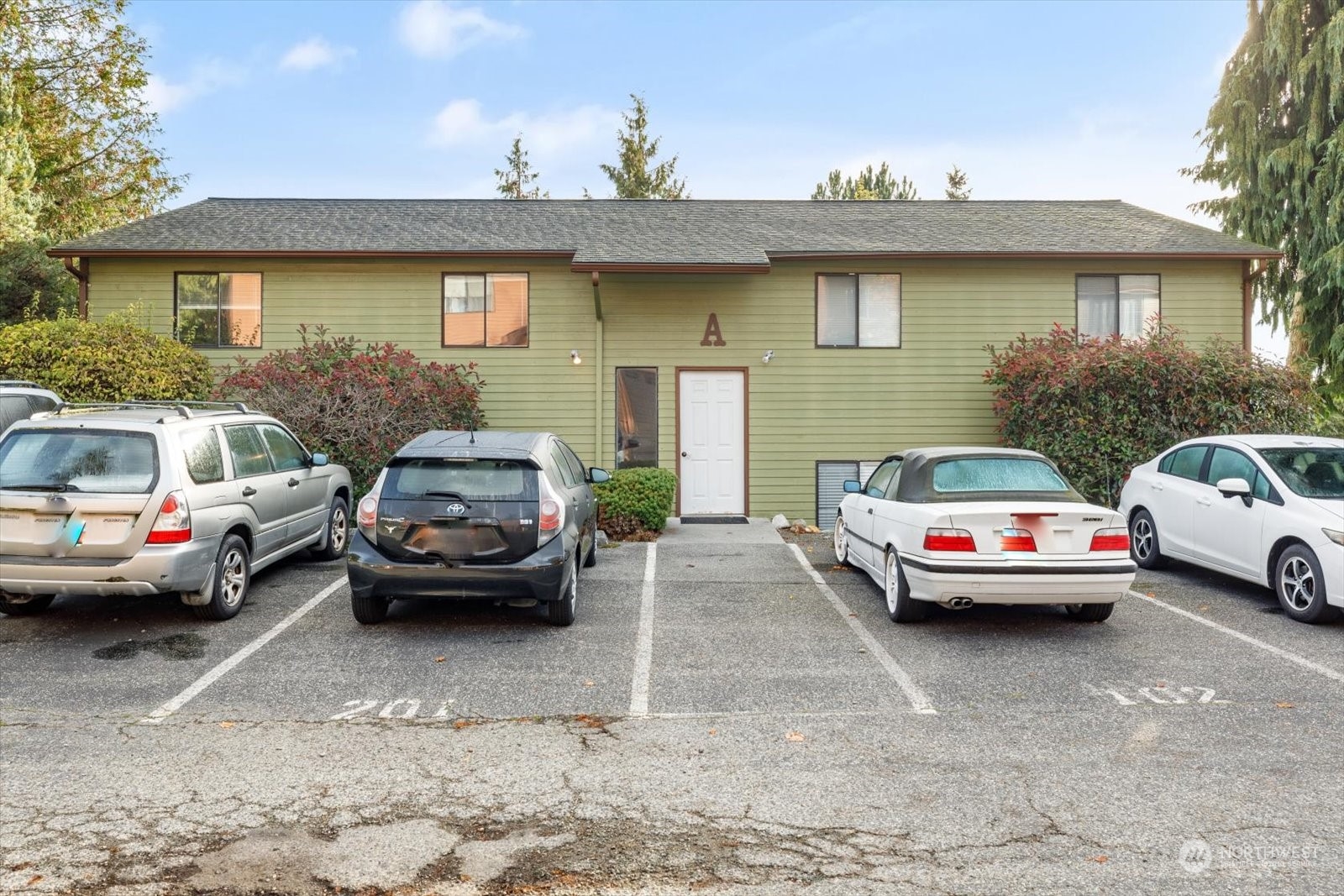 a car parked in front of a house