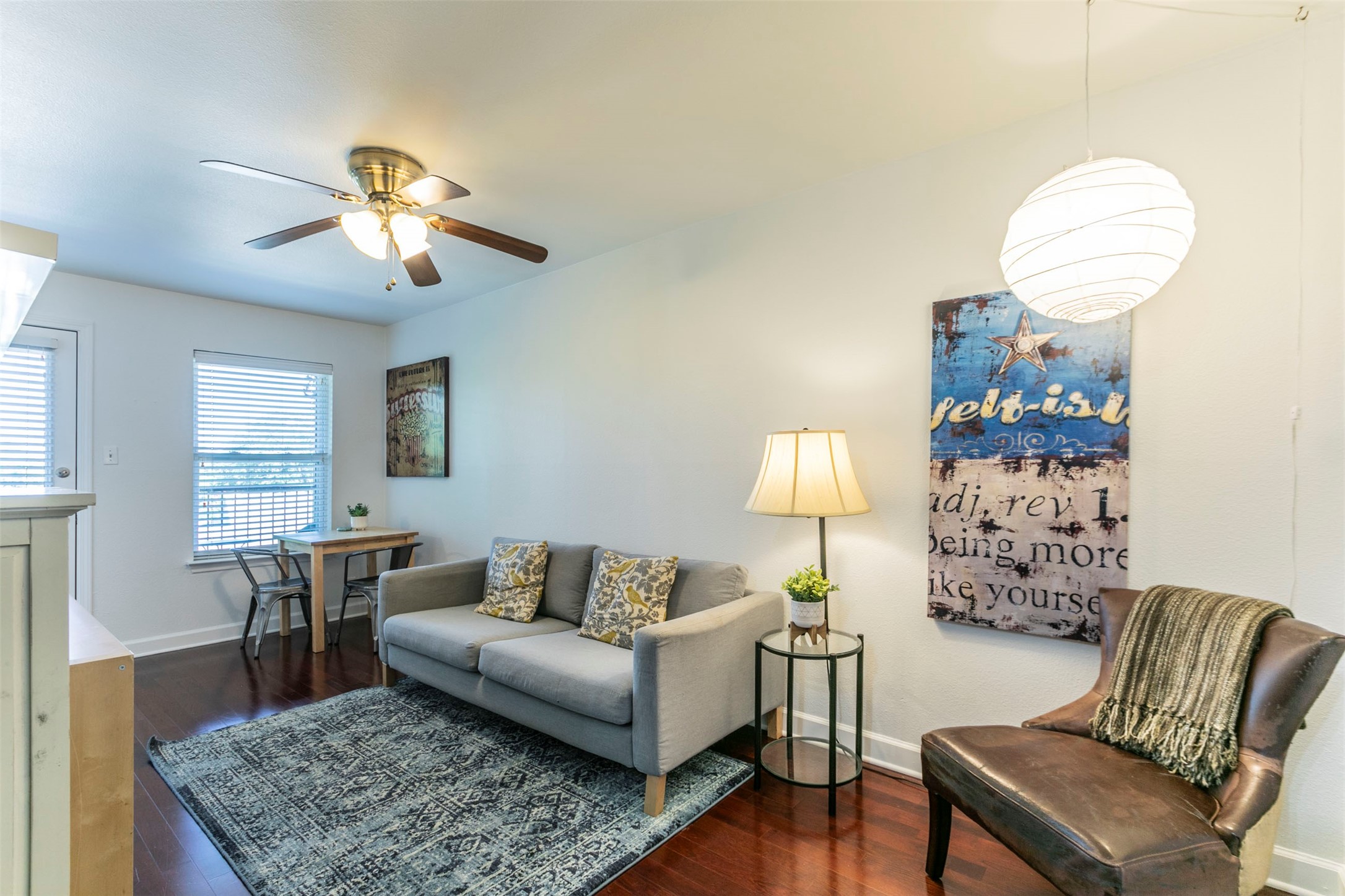 a living room with furniture and a lamp