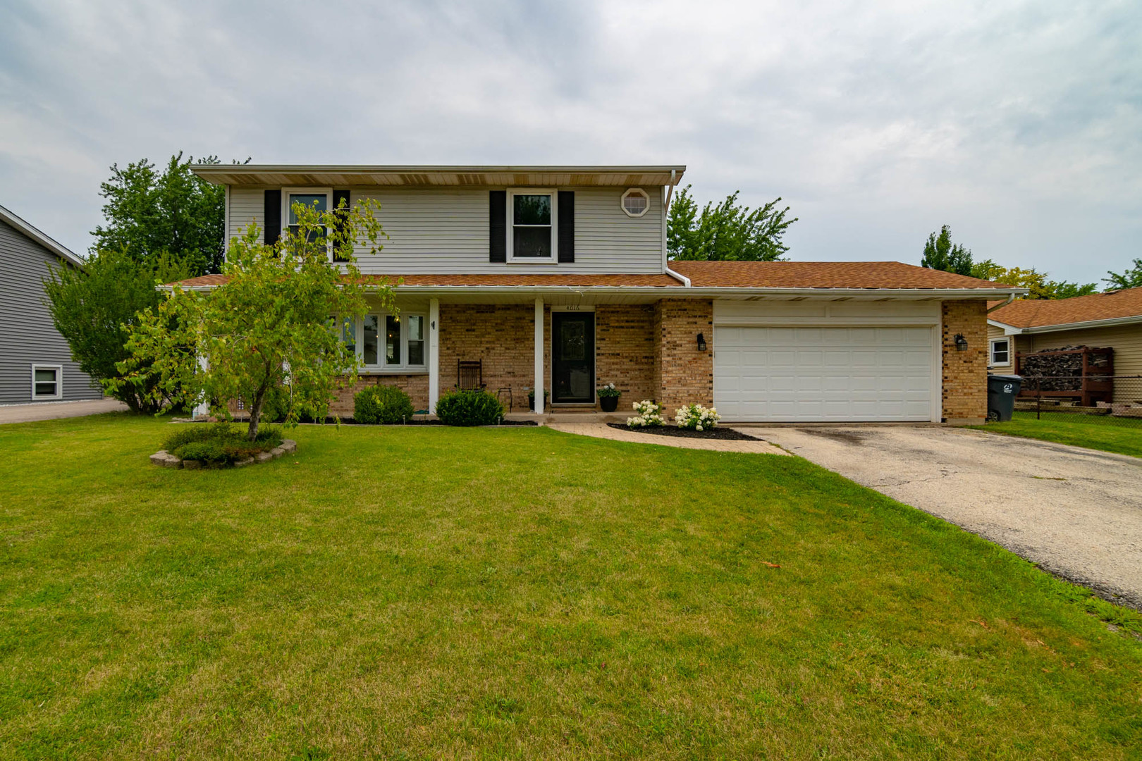 a view of house with outdoor space and yard